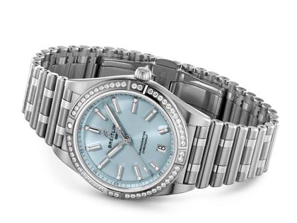Breitling Chronomat Automatic 36 Edelstahl blaues Zifferblatt mit Brillanten zweifarbiges Metallband – Damenuhren Uhr mit Datum aus 750 Weißgold, Edelstahl und Kautschuk. Das Gehäuse ist rund und silber. Das Edelstahlarmband mit Gold ist schwarz. Das Zifferblatt ist ein Index in blau. – Ansicht 4