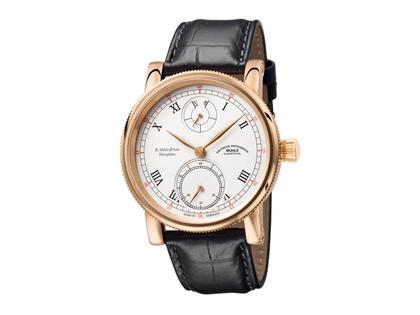 Mühle Glashütte Robert Mühle Auf/Ab Gold Handaufzug Rotgold 44mm weißes Zifferblatt schwarzes Lederband – Herrenuhren Uhr ohne Datum aus 750 Rotgold. Das Gehäuse ist rund und gelbgold. Das Lederarmband Kroko / Alligator ist schwarz. Das Zifferblatt ist römisch und weiß.