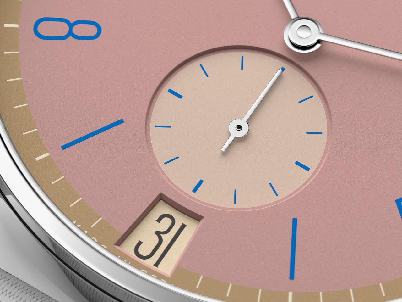 Nomos Glashütte Tangente 38 Datum "175 Years Watchmaking - Pompadour" Handaufzug Edelstahl rosa Zifferblatt graues Textilband Glasboden – Herrenuhren Uhr mit Datum aus Edelstahl. Das Gehäuse ist rund und silber. Das Textilarmband ist grau. Das Zifferblatt ist arabisch Index und rosa. – Ansicht 5
