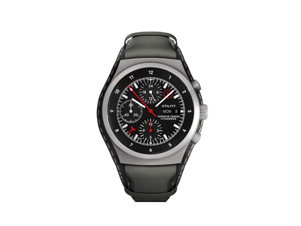 Porsche Design Chronograph 1 - Utility Hodinkee 2026 Limited Edition Automatik Titan 41mm schwarzes Zifferblatt Titanband und Lederband – Herrenuhren Chronograph aus Leder, Titan und Titancarbid beschichtet. Das Gehäuse ist rund und grau. Das Titanarmband ist grau. Das Zifferblatt ist ein Index in schwarz. – Ansicht 2