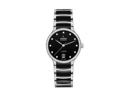 Damenuhren Uhr mit Datum aus Edelstahl und Keramik. Das Gehäuse ist rund und silber. Das Edelstahlarmband ist silber. Das Zifferblatt ist ein Index in schwarz.