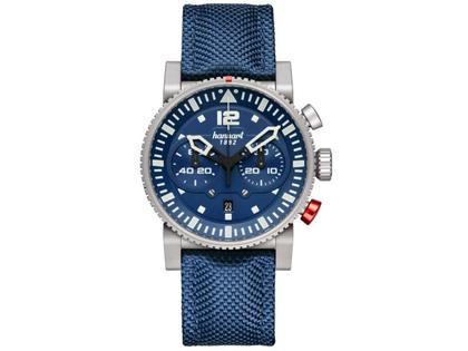 Hanhart PRIMUS Carrier Pilot Chronograph Automatik Edelstahl 44mm blaues Zifferblatt blaues Textilband – Herrenuhren Chronograph aus Edelstahl. Das Gehäuse ist rund und silber. Das Textilarmband ist blau. Das Zifferblatt ist arabisch Index und blau.